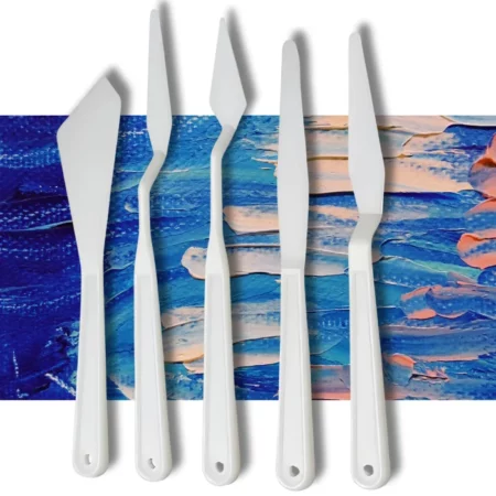 The loose knives from a Prime Art Plastic Palette Knife Set is shown in the frame, The white plastic knives are lined up next to each other vertically across the center of the frame. Each knife has a different shaped plastic blade. on a textured blue and pink background.