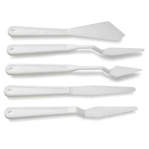 Plastic Palette Knife Set 5 Piece. 5 palette knives are shown horizontally across the center of the frame, one under the other. Each plastic knife has a different shaped head and all palette knives have a drop shadow. On a white background.