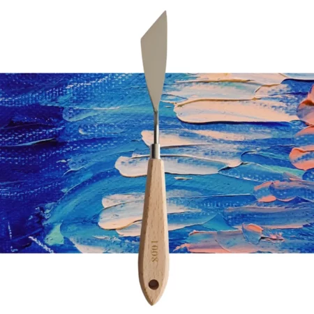 A single Prime Art Palette Knife PK12 is shown vertically, in the center of the frame. The palette knife has a shaped metal blade and a wooden handle. The Prime Art name is printed on the wooden handle. The image is center of the frame and on a textured blue and pink background.