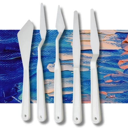 The loose knives from a Prime Art Plastic Palette Knife Set is shown in the frame, The white plastic knives are lined up next to each other vertically across the center of the frame. Each knife has a different shaped plastic blade. and on a textured blue and pink background.