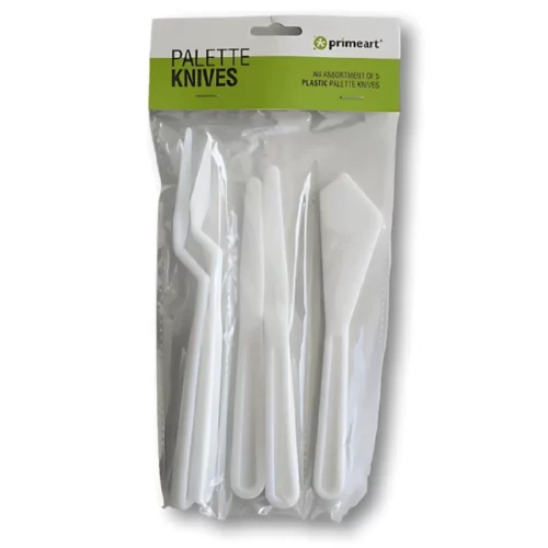 A Prime Art Plastic Palette Knife Set is shown in it's packaging in the center of the frame. The knives are in a clear plastic packet with a cardboard header that is printed with the Prime Art logo. You can see the 5 plastic palette knives through the packaging. Each white plastic palette knife has a different sized blade. On a white background.