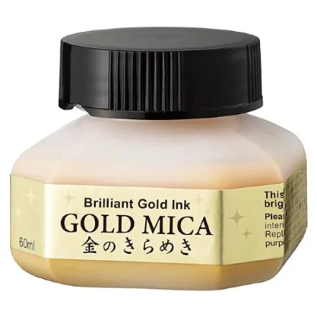 A single bottle of Gold Kuretake Mica Ink can be seen in the center of the frame. The bottle is frosted plastic and has a black plastic screw on lid. There is a label around the body of the bottle with the product name. You can see the coloured ink through the bottle. The image is on a white background.