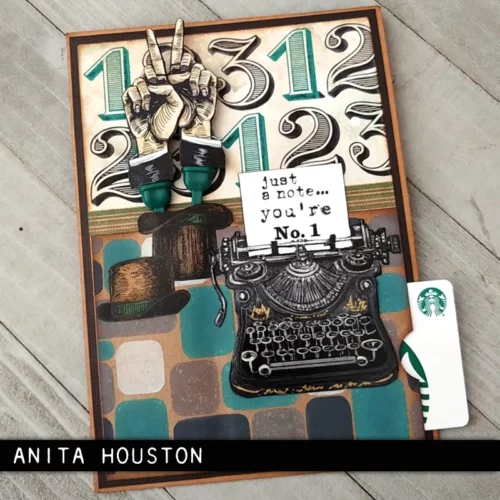 A card that was made with the Curiosity Shop Tim Holtz Stamp Set is shown in the frame. The card is vintage themed and there is a typewriter with a note that has been typed, coming out of the typewriter.