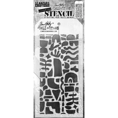 A single Cutout Shapes 2 Tim Holtz Layering Stencil is seen in the center of the frame in it's packaging. The packaging has a printed backing board with a clear plastic that holsd the stencil to the backing board. The backing is printed in grey and has some text at the top of the packaging describing the contents and includes the Tim Holtz logo. You can see the stencil through the clear packaging. The stencil is plastic and tag shaped and the design is cut out from the body of the tag shaped stencil. The image is center of the frame and on a white background.