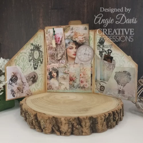 A project that was made using the Ledger Creative Expressions Clear Stamp Set. It is an altered art papercraft project that is vintage styled and displayed on a wooden slice.