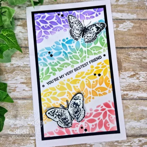 A greeting card was made using the Nature Page Woodware Clear Stamp Set. The background is rainbow coloured and teh butterflies have been stamped in black.