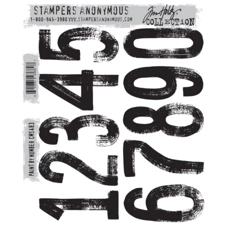 A print out of the front of the Paint By Number Tim Holtz Stamp Set is shown in the center of the frame on a white background. There are large numbers printed on the stamp set in black