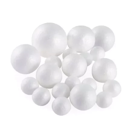 many polystyrene balls are spread around the center of the image. they are a darker white colour on a white background