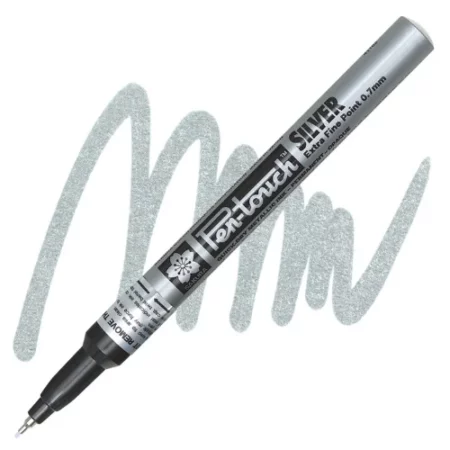 Sakura Pen Touch Marker is diagonal across the center of the image. the tip is pointing towards the bottom left corner and the bottom is pointing to the top right corner. there is a squiggle of colour behind the pen. on a white background.