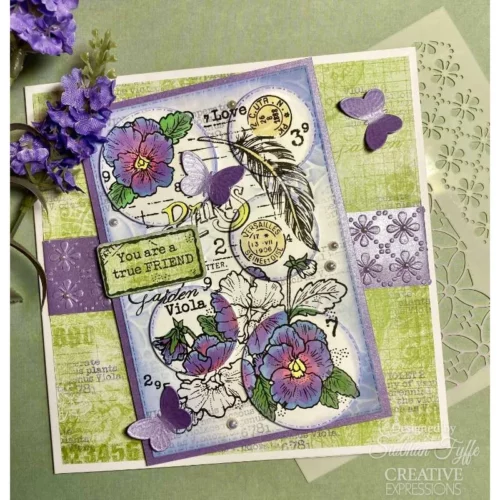 A greeting card was made using the Viola Woodware Clear Stamp Set. The card is purple and green and the flowers have been coloured in.