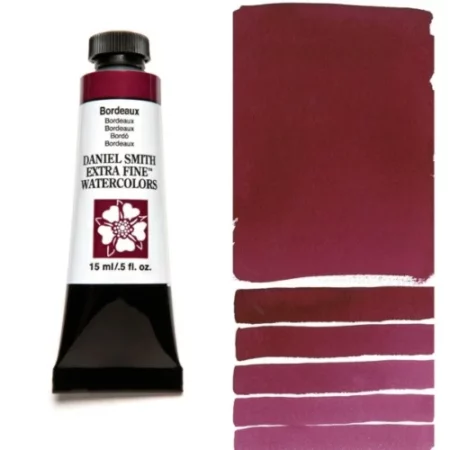 A tube of bordeaux Daniel Smith Watercolour Paint is shown in the frame, to the left hand side of the frame vertically. The tube has a black plastic cap and a black base. The center of the tube is white and there is a colour band at the top of the tube, below the cap, that indicates the colour of the paint. There is black text on the front of the tube with the brand name and logo. To the right of the tube is a colour swatch which was made using the paint. In the colour swatch, you can see the paint undiluted and in a diluted form. The image is on a white background and is center of the frame