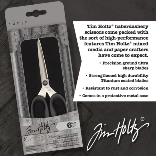 A promotional image for Tim Holtz Haberdashery Scissors. The scissors are inside the tin and the tin is sealed but has a clear cover so you can see the scissors inside. Laying on a faux wooden background and the Tim Holtz Logo is shown in the top right hand corner of the frame.