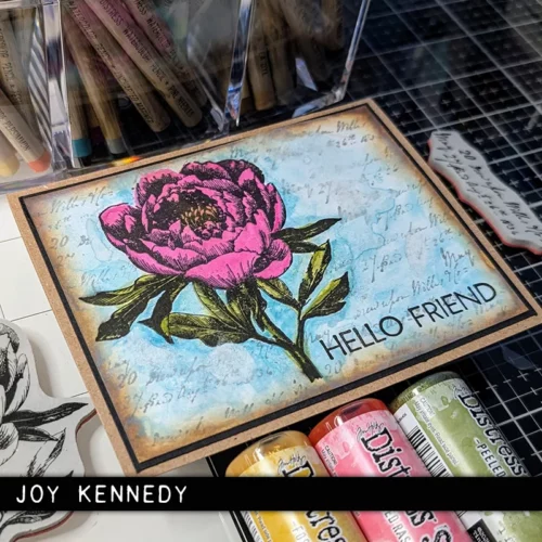 A single card is shown in the center of the frame that was made using the French Garden Tim Holtz Stamp Set. The card is vintage styled and has a blue background with 1 pink flower. The image is cut off by the frame.