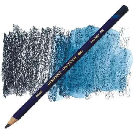 A single Deep Indigo Derwent Inktense Colour Pencil is shown diagonally across the center of the frame. The pencil is pointing with it's lead facing towards the bottom left hand corner. The barrel of the pencil is blue and the end of the pencil is colour dipped to match the colour of the lead for easy identification. There is text down the barrel of the pencil with the colour name and brand name. There is a colour swatch of the pencil in the background, that runs horizontally across the center of the frame. The image is center of the frame and on a white background.