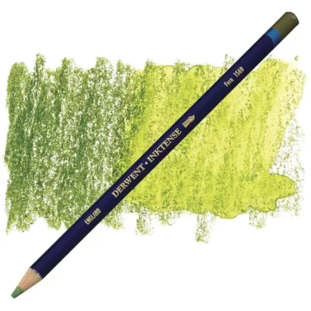 A single Fern Derwent Inktense Colour Pencil is shown diagonally across the center of the frame. The pencil is pointing with it's lead facing towards the bottom left hand corner. The barrel of the pencil is blue and the end of the pencil is colour dipped to match the colour of the lead for easy identification. There is text down the barrel of the pencil with the colour name and brand name. There is a colour swatch of the pencil in the background, that runs horizontally across the center of the frame. The image is center of the frame and on a white background.