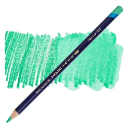 A single Mint Leaf Derwent Inktense Colour Pencil is shown diagonally across the center of the frame. The pencil is pointing with it's lead facing towards the bottom left hand corner. The barrel of the pencil is blue and the end of the pencil is colour dipped to match the colour of the lead for easy identification. There is text down the barrel of the pencil with the colour name and brand name. There is a colour swatch of the pencil in the background, that runs horizontally across the center of the frame. The image is center of the frame and on a white background.