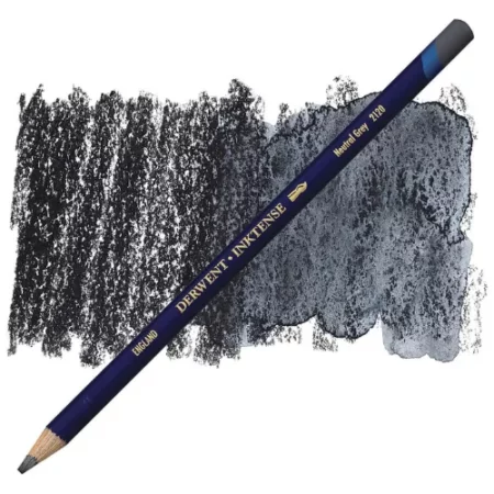 A single Neutral Grey Derwent Inktense Colour Pencil is shown diagonally across the center of the frame. The pencil is pointing with it's lead facing towards the bottom left hand corner. The barrel of the pencil is blue and the end of the pencil is colour dipped to match the colour of the lead for easy identification. There is text down the barrel of the pencil with the colour name and brand name. There is a colour swatch of the pencil in the background, that runs horizontally across the center of the frame. The image is center of the frame and on a white background.