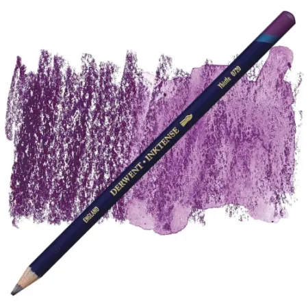 A single Thistle Derwent Inktense Colour Pencil is shown diagonally across the center of the frame. The pencil is pointing with it's lead facing towards the bottom left hand corner. The barrel of the pencil is blue and the end of the pencil is colour dipped to match the colour of the lead for easy identification. There is text down the barrel of the pencil with the colour name and brand name. There is a colour swatch of the pencil in the background, that runs horizontally across the center of the frame. The image is center of the frame and on a white background