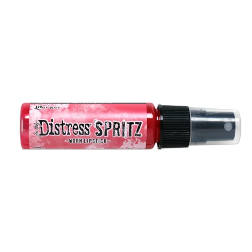 A single bottle of Worn Lipstick Tim Holtz Distress Spritz is shown laying horizontally in the center of the frame. The bottle is a clear plastic with a black plastic spray top and a clear plastic lid. There is a coloured label around the body of the bottle that indicates the colour of the ink. The Distress Logo and product details are printed on the label. The image is center of the frame and on a white background.