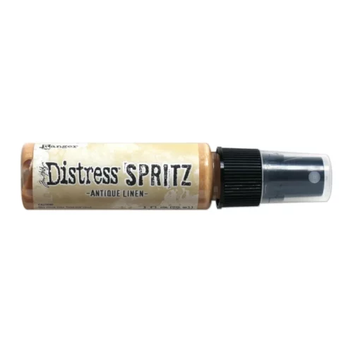 A single bottle of Antique Linen Tim Holtz Distress Spritz is shown laying horizontally in the center of the frame. The bottle is a clear plastic with a black plastic spray top and a clear plastic lid. There is a coloured label around the body of the bottle that indicates the colour of the ink. The Distress Logo and product details are printed on the label. The image is center of the frame and on a white background.