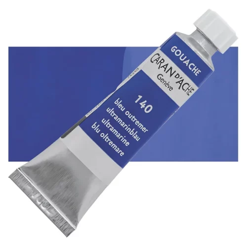 caran-d'ache-gouache-studio-ultramarine is shown diagonally across the center of the frame, overlapping a rectangular colour swatch in the background, which denotes the colour of the paint. The tube is silver and has a label around the body of the tube, that is printed in the colour of the paint. The Caran D'Ache logo, Paint Colour and details are printed on the label. The tube has a white plastic screw on cap. On a white background.