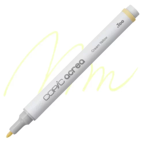 cream yellow Copic Acrea Paint Marker is sitting diagonally across the image. the tip is facing the left hand side . it has a white body and a silver end with a white tip. it is sitting over a squiggle of the same colour on a white background