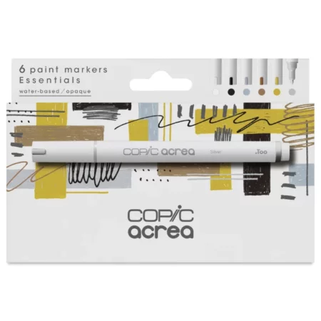 A Copic Acrea Paint Marker Set Essentials is shown diagonally in the center of the frame, so you can see the front of the box and one side. There is a picture of a marker on the box and the Copic Acrea logo in the bottom, center of the box. The box is white white an image of coloured triangles printed on it. On a white background.