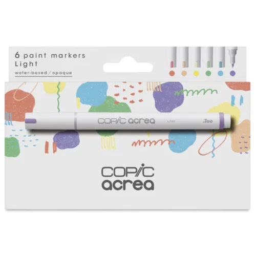 A Copic Acrea Paint Marker Set Light is shown diagonally in the center of the frame, so you can see the front of the box and one side. There is a picture of a marker on the box and the Copic Acrea logo in the bottom, center of the box. The box is white white an image of coloured triangles printed on it. On a white background.