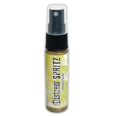 A single bottle of Crushed Olive Tim Holtz Distress Spritz is shown standing vertically in the center of the frame. The bottle is a clear plastic with a black plastic spray top and a clear plastic lid. There is a coloured label around the body of the bottle that indicates the colour of the ink. The Distress Logo and product details are printed on the label. The image is center of the frame and on a white background.