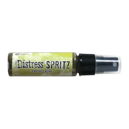 A single bottle of Crushed Olive Tim Holtz Distress Spritz is shown laying horizontally in the center of the frame. The bottle is a clear plastic with a black plastic spray top and a clear plastic lid. There is a coloured label around the body of the bottle that indicates the colour of the ink. The Distress Logo and product details are printed on the label. The image is center of the frame and on a white background.