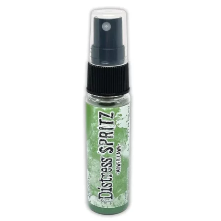 A single bottle of Mowed Lawn Tim Holtz Distress Spritz is shown standing vertically in the center of the frame. The bottle is a clear plastic with a black plastic spray top and a clear plastic lid. There is a coloured label around the body of the bottle that indicates the colour of the ink. The Distress Logo and product details are printed on the label. The image is center of the frame and on a white background.