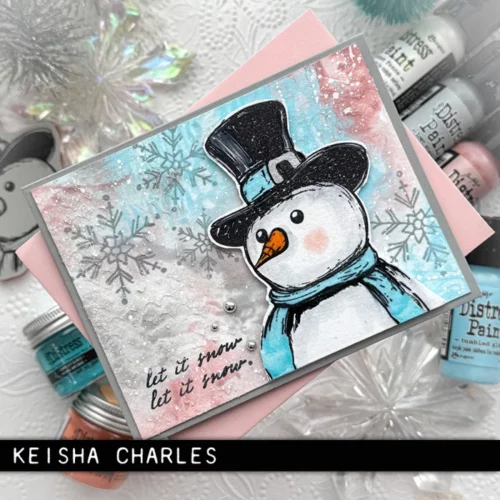 The image shows a craft project that was made using the Mr Frostie Tim Holtz Stamp Set.