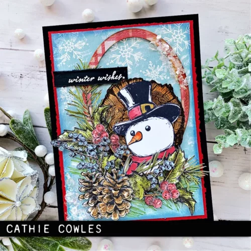 The image shows a craft project that was made using the Mr Frostie Tim Holtz Stamp Set.