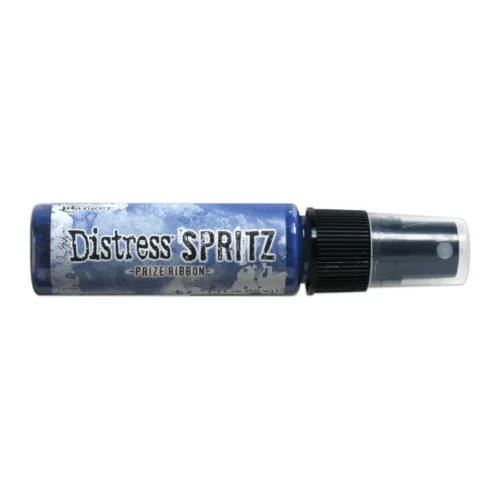 A single bottle of Prize Ribbon Tim Holtz Distress Spritz is shown laying horizontally in the center of the frame. The bottle is a clear plastic with a black plastic spray top and a clear plastic lid. There is a coloured label around the body of the bottle that indicates the colour of the ink. The Distress Logo and product details are printed on the label. The image is center of the frame and on a white background.