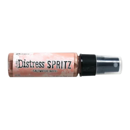 A single bottle of Saltwater Taffy Tim Holtz Distress Spritz is shown laying horizontally in the center of the frame. The bottle is a clear plastic with a black plastic spray top and a clear plastic lid. There is a coloured label around the body of the bottle that indicates the colour of the ink. The Distress Logo and product details are printed on the label. The image is center of the frame and on a white background.