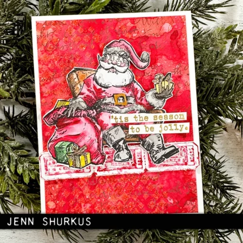 The image shows a craft project that was made using the Santa Visit Tim Holtz Stamp Set.