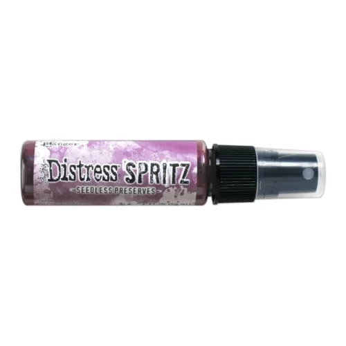 A single bottle of Seedless Preserves Tim Holtz Distress Spritz is shown laying horizontally in the center of the frame. The bottle is a clear plastic with a black plastic spray top and a clear plastic lid. There is a coloured label around the body of the bottle that indicates the colour of the ink. The Distress Logo and product details are printed on the label. The image is center of the frame and on a white background.